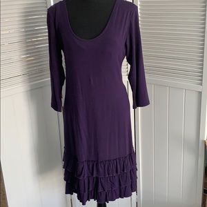 purple dress with layered ruffles on the bottom.